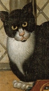 A black and white cat, staring directly at the portrait painter. This is the cat that appears in the Tower Portrait with the Earl of Southampton.